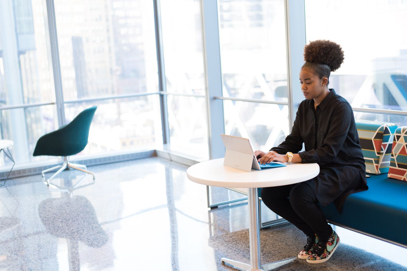 A woman working confidently with technology
